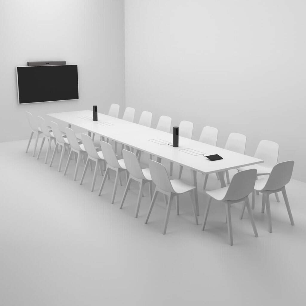 Web conferencing equipment setup in a modern meeting room with multiple chairs and a large screen.