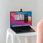 High-quality webcam and video conferencing setup with a MacBook for live streaming.