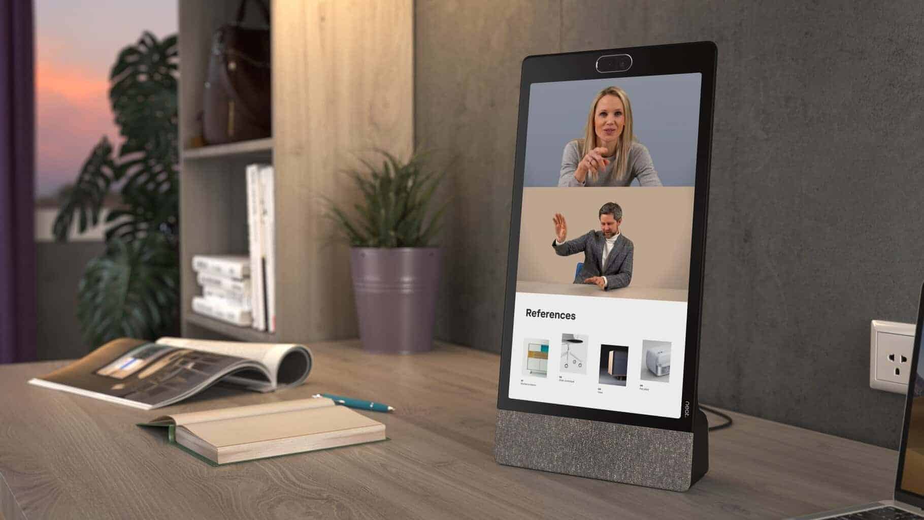Webcam and video conferencing device with display showing remote meetings and references.